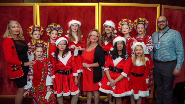 The troupe of Holiday Elf singers